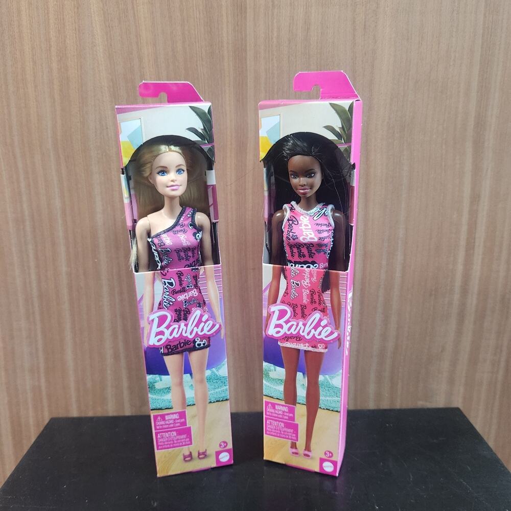 2 Barbie Dolls Straight Black Hair and Blond hair Pink Dress with Logo Print